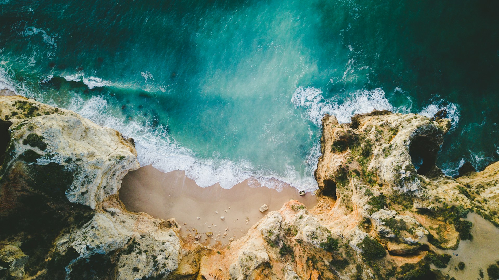 Turquoise Atlantic water meeting the cliffs of Portugal